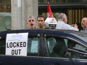 Locked out airport taxi drivers protest at the Ottawa airport Friday, Aug. 14, 2015. Tony Caldwell/Ottawa Sun/Postmedia Network