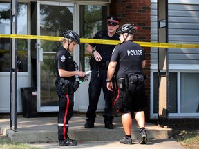 Police investigates a suspicious death in a apartment on 104 ave and 106 st in Edmonton, Alberta on Tuesday August 25, 2015. Perry Mah/Edmonton Sun