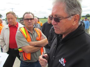 Ross Tius, right, business manager with Local 663 of the plumbers and pipefitters union, speaks to reporters on Tuesday August 25, 2015 in St. Clair Township, Ont., at an information picket line set up at the Easter Power Limited construction site. Workers are raising the alarm over safety conditions at the site. (Paul Morden/Sarnia Observer/Postmedia Network)