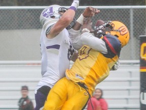 Western safety Jesse McNair breaks up a pass to Queen?s receiver Curtis Carmichael last season. Having McNair back healthy ?solidifies what we do,? defensive co-ordinator Paul Gleason said. (Postmedia News)