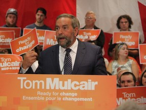 Federal NDP leader Thomas Mulcair addresses hundreds of supporters gathered at the Holiday Inn in Point Edward Tuesday night. Mulcair tackled the topic of poverty -- an election issue Sarnia Mayor Mike Bradley has criticized federal leaders on -- during his campaign stop. (Barbara Simpson/Sarnia Observer/Postmedia Network)