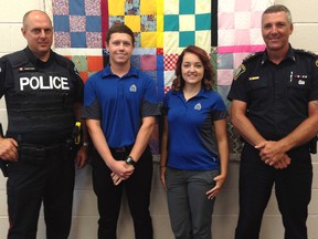 St. Thomas Police Const. Brian Kempster, left, and Chief Darryl Pinnell, right, bid farewell to their paid summer students Kyle Cuthbert and Tieler Peddie at a lunch Tuesday. The two high school students worked in civilian positions within the department as part of the Youth in Policing Initiative and are hoping to pursue a career in policing.