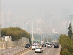 A normally clear view of the city skyline from Macleod Trail is barely distinguishable as smoke from distant wildfires shrouds the view in Calgary on Aug. 25, 2015. (Lyle Aspinall/Calgary Sun/Postmedia Network)