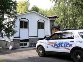 A Kingston Police vehicle in parked in front of a home at 262 Weller Avenue in Kingston on Wednesday August 26 2015 after a suspicious overnight fire. Ian MacAlpine/Kingston Whig-Standard/Postmedia Network.