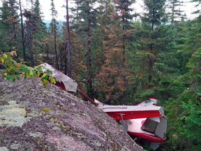 The wreckage of a de Havilland Beaver float plane which crashed August 23, 2015, in a remote area near Les Bergeronnes, Quebec, is seen in a photo from the Transportation Safety Board of Canada released August 24, 2015. The plane was operated by Air Saguenay, according to a news release from the Transportation Safety Board of Canada. REUTERS/Transportation Safety Board of Canada/Handout