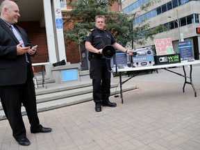 EMILY MOUNTNEY-LESSARD/THE INTELLIGENCER
Tim Newman, CEO of B.R.A.K.E.R.S. Early Warning Systems, with Belleville fire chief Mark MacDonald, speaks about his software system during the official product launch at Market Square, Wednesday in Belleville.