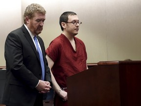 Colorado movie massacre gunman James Holmes stands with defence attorney Daniel King, left, at a court hearing, before beginning his life sentence with no chance of parole, in Centennial, Colorado August 26, 2015. Holmes was sentenced to 12 lifetimes and the maximum 3,318 years in prison.  REUTERS/RJ Sangosti/Pool