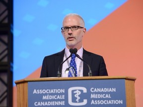 Dr. Jeff Blackmer, vice-president of medical professionalism for the Canadian Medical Association, speaking to delegates at the CMA's annual meeting in Halifax Tuesday, Aug. 25, 2015. THE CANADIAN PRESS/ho-CMA-Mark Holleron