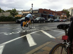 New markings painted on Wellington St. W in Hintonburg warn cyclists of the "dooring zone." (TONY SPEARS/Ottawa Sun/Postmedia Network)