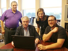 The Sarnia Historical Society has launched a revamped website at sarniahistoricalsociety.com. Board members Phil Egan, left, Laura Greaves and Ron Reale Smith are pictured celebrating its official launch with Sarnia Mayor Mike Bradley, centre. (Handout/Sarnia Observer/Postmedia Network)