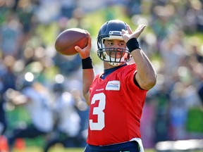 Seattle Seahawks quarterback Russell Wilson throws during NFL football training camp on Aug. 19, 2015, in Renton, Wash. (AP Photo/Elaine Thompson)