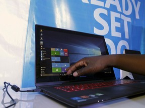 A Microsoft delegate checks applications on a computer during the launch of the Windows 10 operating system in Kenya's capital Nairobi, July 29, 2015. REUTERS/Thomas Mukoya