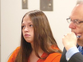 Brittany Pilkington appears for arraignment on three capital murder charges with her attorney Marc S. Triplett on Wednesday, Aug. 26, 2015, in Logan County Common Pleas Court in Bellefontaine, Ohio. Pilkington is charged with suffocating her three sons over a 13-month period. (Joel E. Mast/Bellefontaine Examiner via AP)