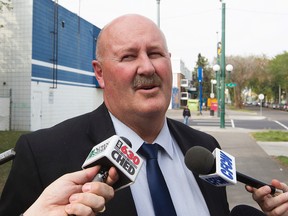 Homicide Staff Sgt. Bill Clark speaks to the media following a suspicious death at an apartment building at 10650 - 104 St., in Edmonton Alta. on Tuesday Aug. 25, 2015.