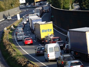 Cars line up in a traffic jam on the western Austrian A12 highway in this September 28, 2012 file photo. (REUTERS/Dominic Ebenbichler)