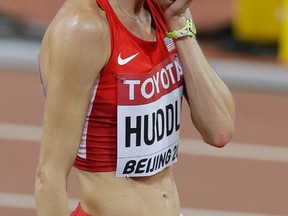 United States' Molly Huddle reacts after the women’s 10,000m final at the World Athletics Championships at the Bird's Nest stadium in Beijing, Monday, Aug. 24, 2015. (AP Photo/Darron Cummings)