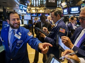 Traders work on the floor of the New York Stock Exchange shortly after the opening bell in New York August 27, 2015. (REUTERS/Lucas Jackson)