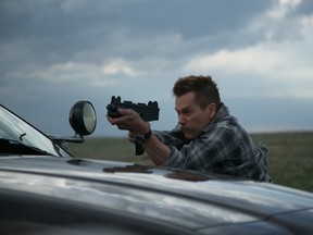 Kevin Bacon in a scene from Cop Car. (Handout photo)