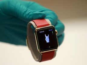 A sales assistant shows an Apple Watch Edition at an Apple reseller shop in Bangkok, Thailand, in this July 17, 2015 file photo. (REUTERS/Chaiwat Subprasom/Files)