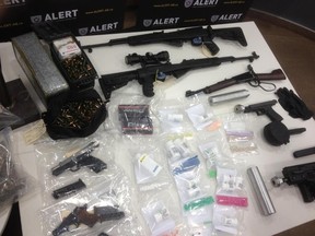 Huge stash of guns and drugs seized by ALERT in Edmonton. Dave Lazzarino/Edmonton Sun