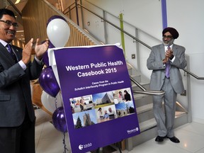 Dr. Amit Chakma (left), president of Western University, and Dr. Amardeep Thind, director of the Schulich Interfaculty Program in Public Health, celebrate the release of Western’s first public health casebook in London Ont. August 27, 2015. CHRIS MONTANINI\LONDONER\POSTMEDIA NETWORK