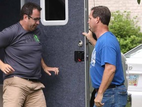 In this July 7, 2015 file photo Subway restaurant spokesman Jared Fogle leaves a mobile evidence-gathering lab outside of his home as Indianapolis Metropolitan Police Department Det. Darin Odier holds the door, in Zionsville, Ind.  The extensive investigation that led this week to longtime Subway pitchman Jared Fogle agreeing to plead guilty to sex and child pornography crimes shines the brightest spotlight yet on an Indiana task force devoted to pursuing crimes against children that is one of the nation's most aggressive and effective child pornography hunters.  (Charlie Nye/The Indianapolis Star via AP)