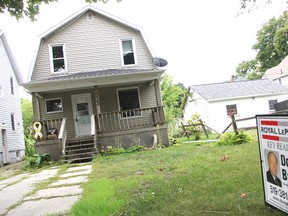 The owners of this Sarnia home have started a crowdfunding campaign to pay off its remaining costs, so they can donate it to Habitat for Humanity. The Confederation Street home is currently listed for $98,900. (Tyler Kula/Sarnia Observer/Postmedia Network)