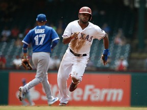 Rangers' Delino DeShields advances to third on a single by teammate Adrian Beltre in the first inning yesterday. The Jays lost 4-1 to conclude their road trip. (AP)