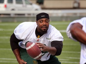 Thaddeus Coleman handles the football during Edmonton Eskimos' walk through at Commonwealth Stadium on Thursday. (Perry Mah, Edmonton Sun)