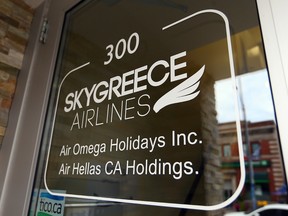 The closed and locked offices of Skygreece Airlines on Danforth Ave in Toronto on Thursday August 27, 2015. (Dave Abel/Toronto Sun)