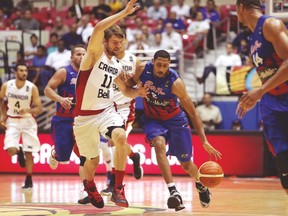 Canada’s Aaron Doornekamp — a potential final cut — plays defence against Puerto Rico’s Richard Chaney on Wednesday night. (Jose Jimenez Tirado/FIBA Americas)