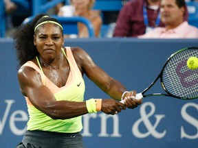 Serena Williams returns the ball to Elina Svitolina during the semifinals at the Western & Southern Open in Mason, Ohio. (AP Photo/John Minchillo, File)