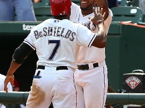 Delino DeShields of the Texas Rangers celebrates after advancing to home on an error in the seventh inning during a game against the Toronto Blue Jays at Globe Life Park in Arlington on August 27, 2015 in Arlington, Texas. (SARAH CRABILL/Getty Images/AFP)