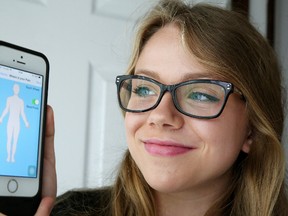 Mia Pandolfo shows off her cellphone app that she invented to help track and diagnose chronic pain. Gino Donato/Sudbury Star/Postmedia Network