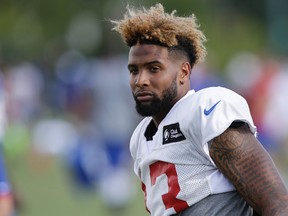 New York Giants wide receiver Odell Beckham Jr. turns to walk back toward the locker rooms after a joint NFL football training camp with the Cincinnati Bengals, Wednesday, Aug. 12, 2015, in Cincinnati. (AP Photo/John Minchillo)
