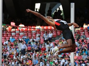 Damian Warner of London makes an attempt during the decathlon high jump at the world athletics championships at the Bird?s Nest stadium in Beijing, China on Friday. Warner cleared a season-best 2.04 metres. (The Associated Press)