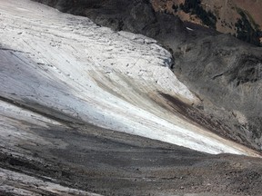 In this Aug. 7, 2015, photo a glacier on a slope shows signs of melting in Mount Baker, Wash. Glaciers on Mount Baker and other mountains in the North Cascades are thinning and retreating. (AP Photo/Manuel Valdes)