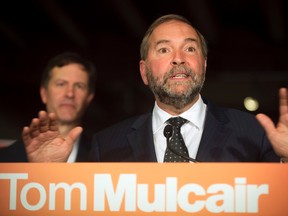NDP Leader Tom Mulcair talks to supporters and the press as he takes his campaign to the new federal riding of Notre-Dame-de-Grace-Westmount, in Montreal, on Friday, August 28, 2015. THE CANADIAN PRESS/Peter McCabe