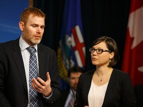 Dr. Andrew Leach (left), panel chair and Shannon Phillips, Minister of Environment and Parks, speak about the creation of an advisory panel to study the province's climate change policy at the media room at the Alberta Legislature in Edmonton, Alta., on Thursday June 25, 2015. Ian Kucerak/Edmonton Sun