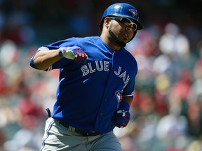 Toronto Blue Jays designated hitter Edwin Encarnacion celebrates after hitting a home run against the Los Angeles Angels at Angel Stadium of Anaheim on Aug. 23, 2015. (Kelvin Kuo/USA TODAY Sports)