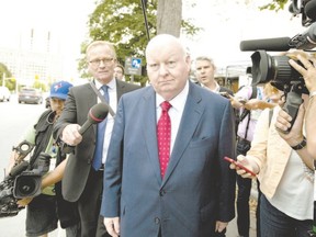 Sen. Mike Duffy, a former Conservative caucus member, leaves the courthouse in Ottawa on Tuesday. His trial is expected to break until November. (Justin Tang, The Canadian Press)