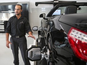 Mercedes-Benz foreman Talil Al-Khafaji demonstrates a computerized wheel alignment system following a press conference in Winnipeg, Man. Thursday August 27, 2015 where Mercedes-Benz Winnipeg announced involvement in a technician award in conjunction with Red River College.