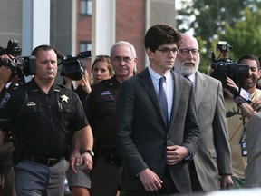 Owen Labrie leaves Merrimack Superior Court with his attorney Jay Carney in Concord, N.H. , on Friday, Aug. 28, 2015 in Concord, N.H.  Labrie was cleared of felony rape but convicted of misdemeanor sex offenses Friday against a 15-year-old girl in a case that exposed a campus tradition in which the oldest students of St. Paul's School competed to see how many younger students they could have sex with.  Each count carries up to a year behind bars. Labrie could get as much as 11 years in prison at sentencing Oct. 29. He will also have to register as a sex offender for the rest of his life. (Geoff Forester/The Concord Monitor via AP, Pool)