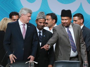 Prime Minister Stephen Harper (L) at the Ahmadiyya Muslim Jama'at, Canada’s largest National Islamic Convention on Friday August 28, 2015 in Mississauga Ontario. Veronica Henri/Toronto Sun/Postmedia Network