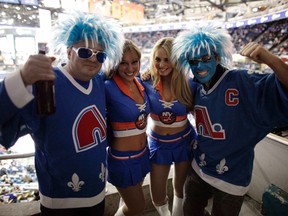 Fans of the Quebec Nordiques cheer along with the Islander Ice Girls during NHL action in Uniondale, N.Y., in 2010. (Chip East/Reuters/Files)
