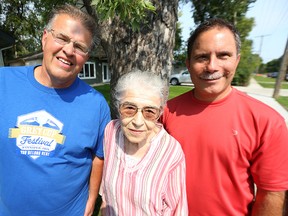 Author Daniel Perron (right) has written a book called Dancing Gabe: One Step at a Time about Winnipeg sports personality Gabe Langlois (left). They're pictured outside the Langlois home in St. Vital with his mother Angelina on Fri., Aug. 28, 2015.