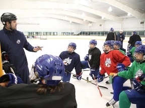 Head coach Shawn Frappier explains a drill to his Sudbury Wolves minor midget AAA players during practice in Sudbury, Ont. on Thursday August 27, 2015. Gino Donato/Sudbury Star/Postmedia Network