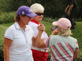 Judith Kyrinis is congratulated for her second-place finish at the Canadian Women's Mid-Amateur and Senior Championship. Kyrinis was tied for the lead until the final hole of the tournament. (Terry Bridge, The Observer)