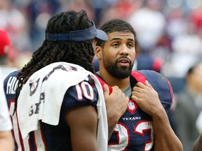 The fantasy stock of a couple of Houston Texans doesn’t look too promising at the moment: Running back Arian Foster (right) because of his groin injury, and wide receiver DeAndre Hopkins (left) because of the team’s sorry QB situation. (USA TODAY SPORTS)