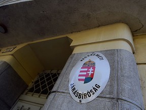 A logo of Kecskemet court is seen at the facade on August 29, 2015. Four defendants appeared in court in a Hungarian town of Kecskemet over Austria's migrant truck tragedy, as a "horrified and heartbroken" UN chief called for concerted action to end Europe's refugee crisis. (AFP PHOTO / ATTILA KISBENEDEK)